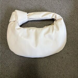 Melie Bianco Cream Clutch with Crescent Shape